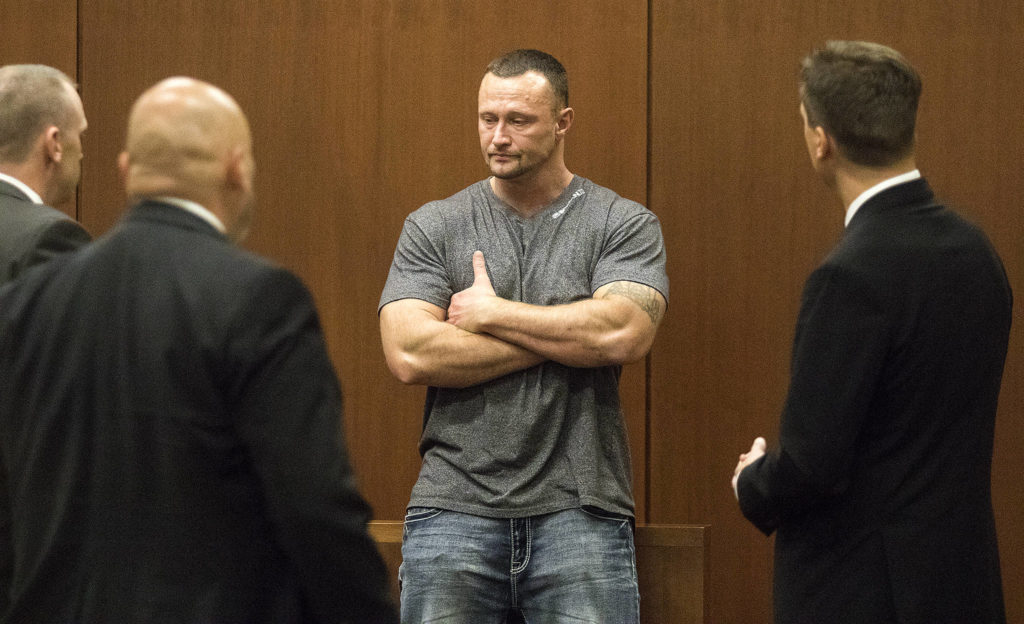 Emotional after hours of testimony, Lance Cleator takes a break before more questioning by Deputy Prosecutor Matt Hunter (right) in the Anthony Garver murder trial in the Snohomish County Courthouse on Wednesday in Everett. (Andy Bronson / The Herald)
