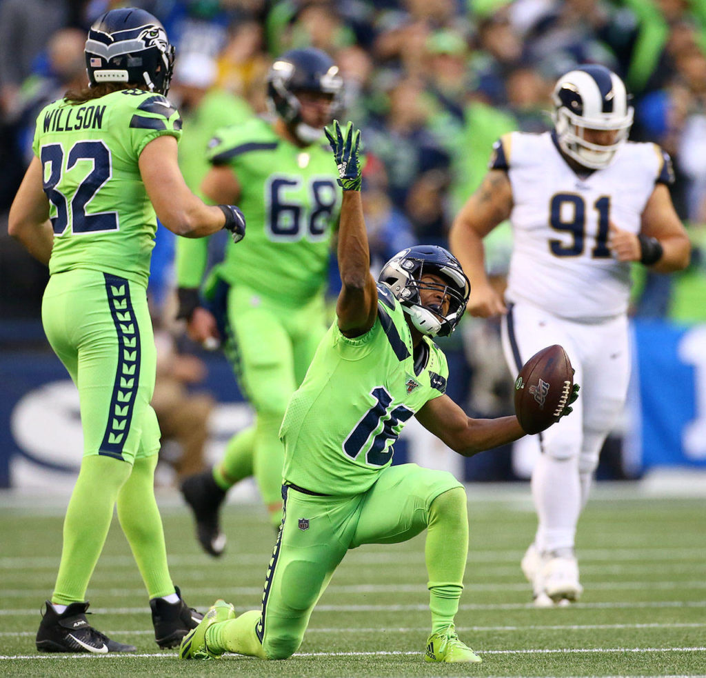 Seattle’s Tyler Lockett celebrates a first down during the Seahawks 30-29 win over the L.A. Rams on Thursday at CenturyLink Field in Seattle. (Kevin Clark / The Herald)
