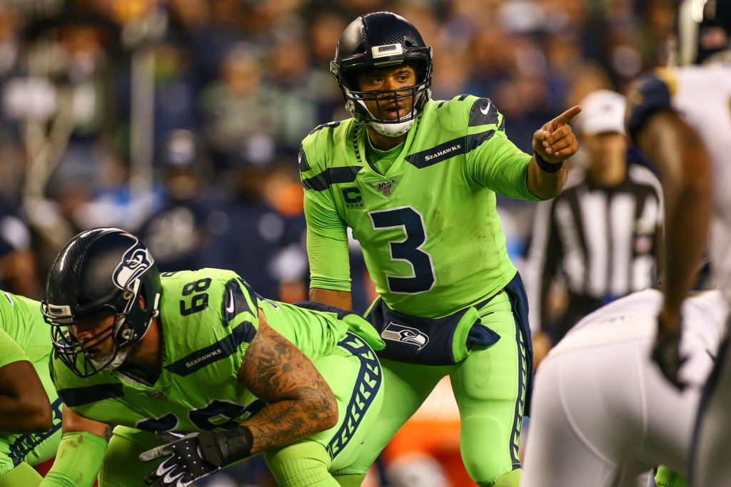 Seattle quarterback Russell Wilson calls signals under center during the Seahawks 30-29 win over the L.A. Rams on Thursday at CenturyLink Field in Seattle. (Kevin Clark / The Herald)
