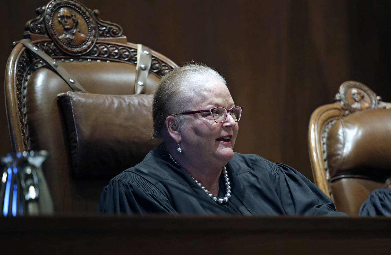 In this June 11 photo, Chief Justice Mary E. Fairhurst looks on during a hearing before the Washington Supreme Court in Olympia. (AP Photo/Elaine Thompson, File)