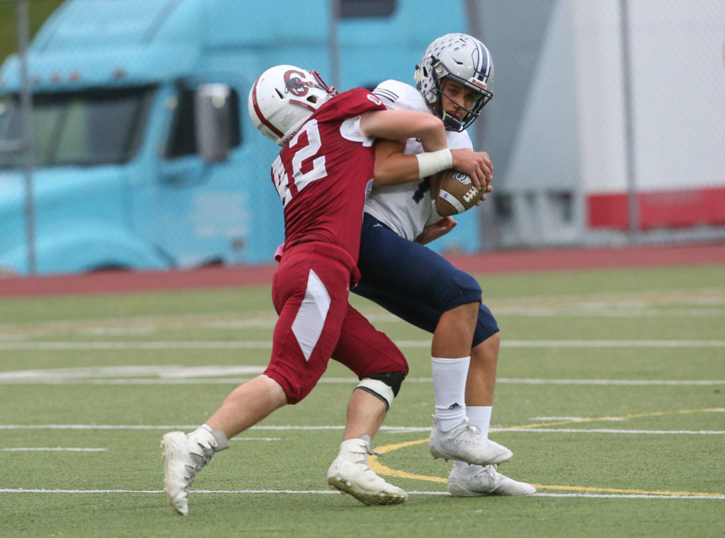 Cascade’s Ronan Mckague sacks Glacier Peak’s Tyson Lang for a loss as Glacier Peak took on Cascade in football at Everett Memorial Stadium on Friday, Oct. 4, 2019 in Everett, Wash. (Andy Bronson / The Herald)
