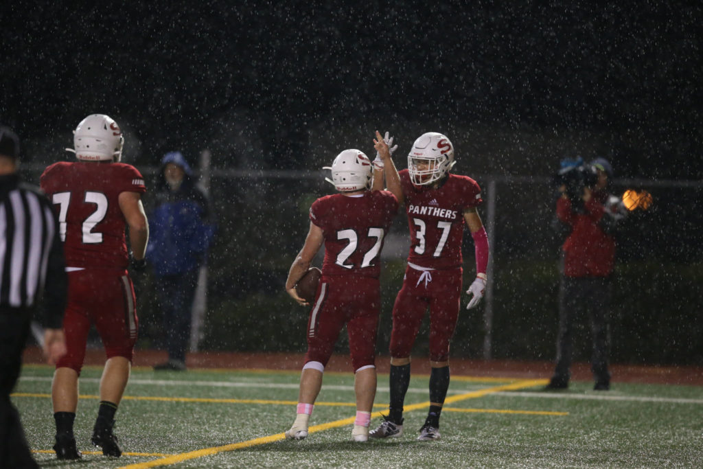 Snohomish’s Jacob Brandvold (37) high fives Tyler Larson after Larson’s touchdown. Shorecrest beat Snohomish 36-35 at Veterans Stadium at Snohomish High School on Friday, Oct. 4, 2019 in Snohomish, Wash. (Andy Bronson / The Herald)
