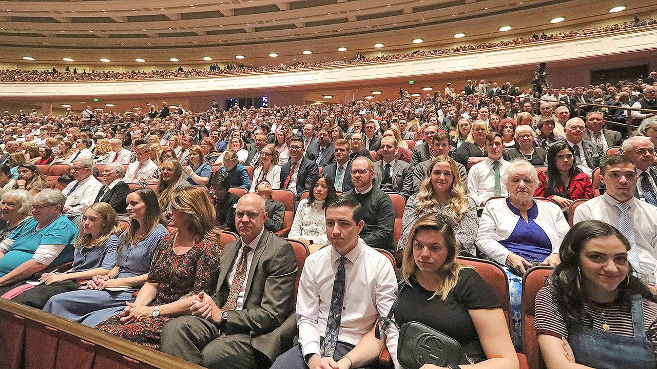 People listen during The Church of Jesus Christ of Latter-day Saints’ twice-annual church conference Saturday in Salt Lake City. President Russell M. Nelson has rolled out a dizzying number of policy changes during his first two years at the helm of the faith, leading to heightened anticipation for what he may announce at this weekend’s conference in Salt Lake City. (AP Photo/Rick Bowmer)