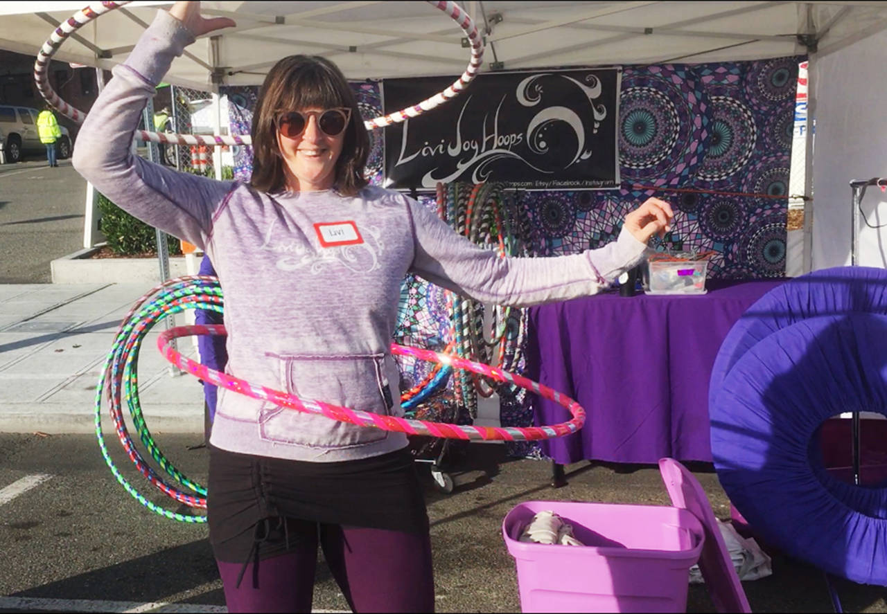 Livi Aley, of Marysville, owner of Livi Joy Hoops, says she loved the Everett Farmers Market’s waterfront location but the downtown venue has “more of a community feel.” (Sue Misao / The Herald)