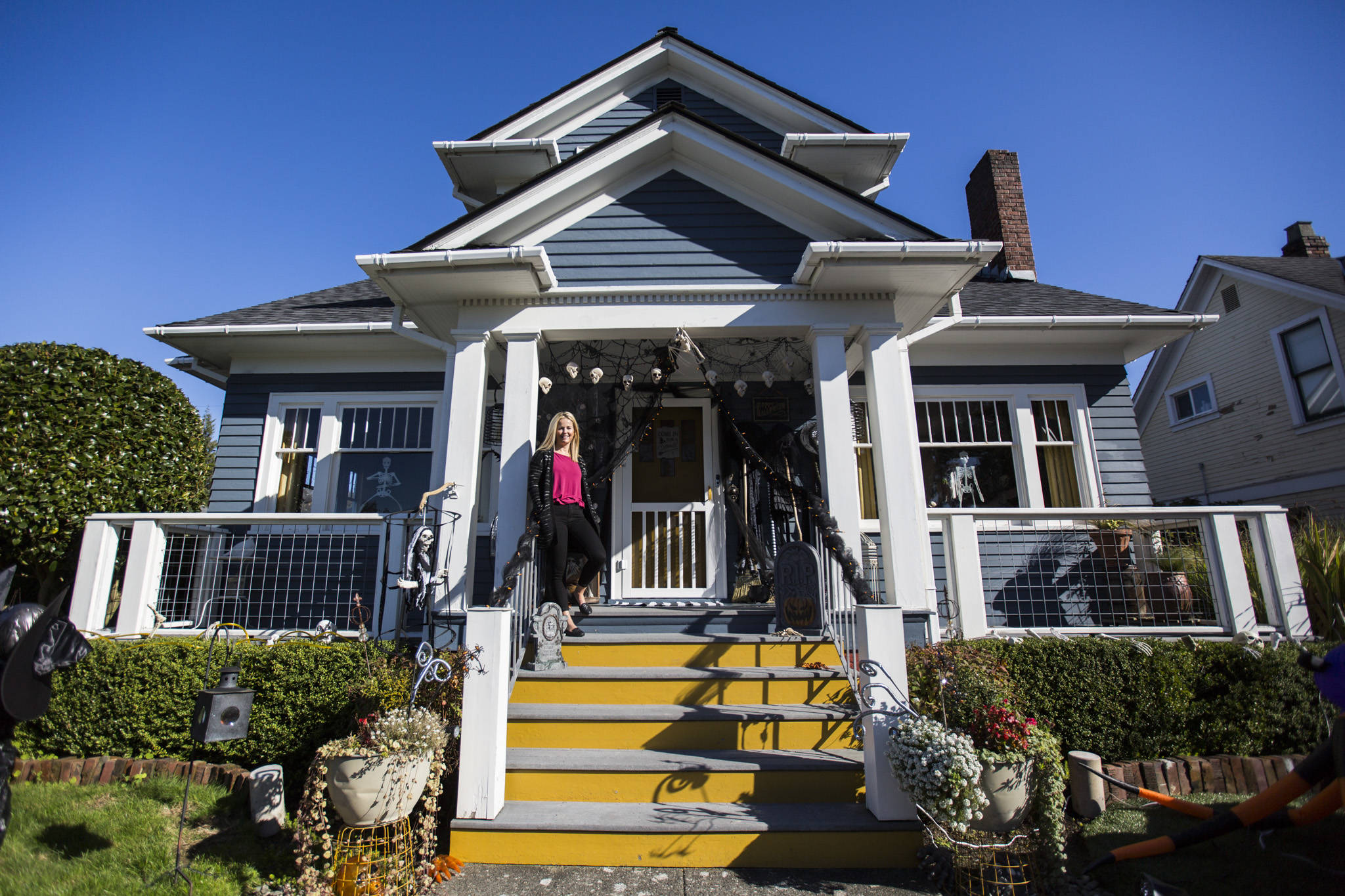 Lorraine Matuschak relaxes on the front porch of her 1925 Craftsman home, which won the 2019 Marian Krell Award in Everett’s Monte Cristo Awards. (Olivia Vanni / The Herald)