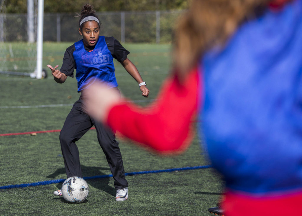 Everett Community College’s Olivia Lee passes the ball during the Trojans’ Oct. 8 practice at Kasch Park in Everett. (Olivia Vanni / The Herald)
