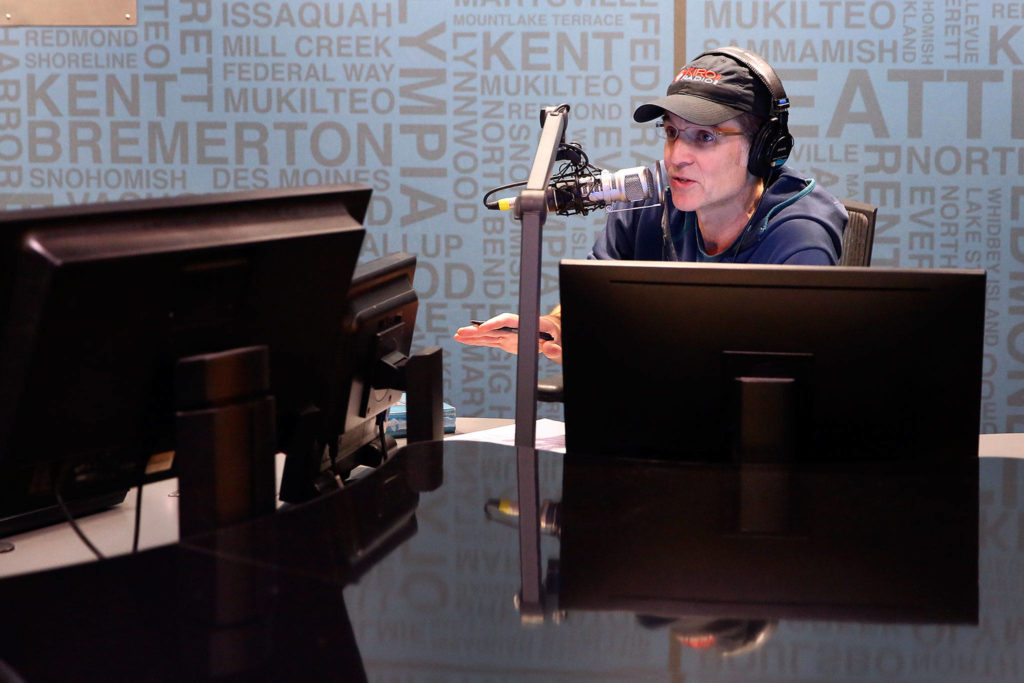 Local historian Feliks Banel, seen on the air with KIRO Radio, will talk about the Pacific Northwest’s infamous storms at two library events in Lynnwood and Marysville. (Kevin Clark / The Herald)
