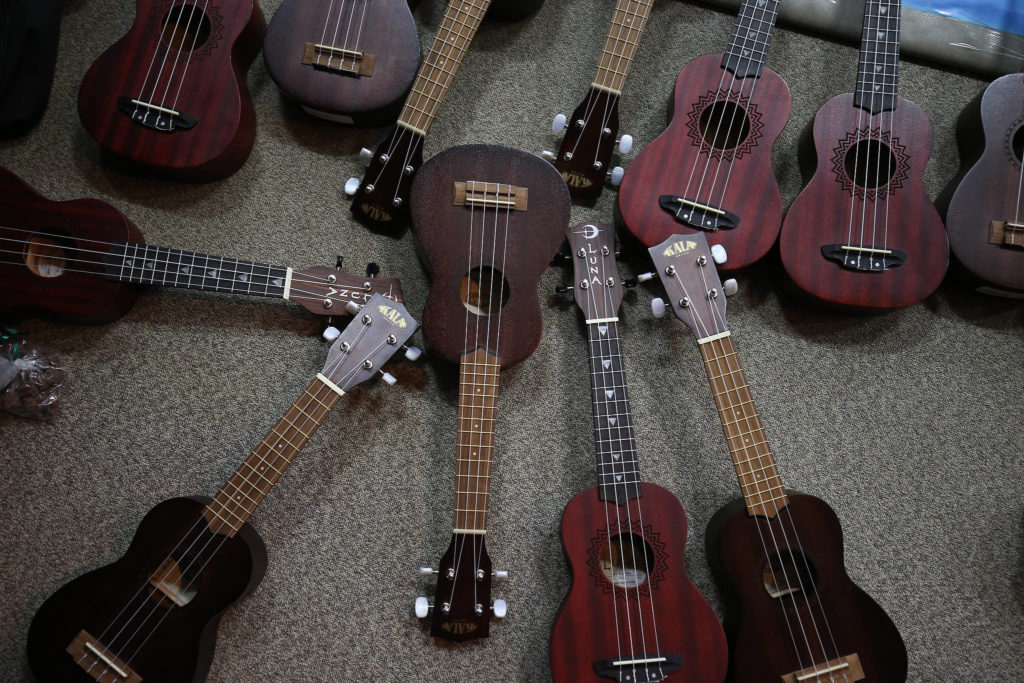 Ukuleles are put out for students before Jake Shimabukuro performs at Frank Wagner Elementary on Monday in Monroe. (Andy Bronson / The Herald)
