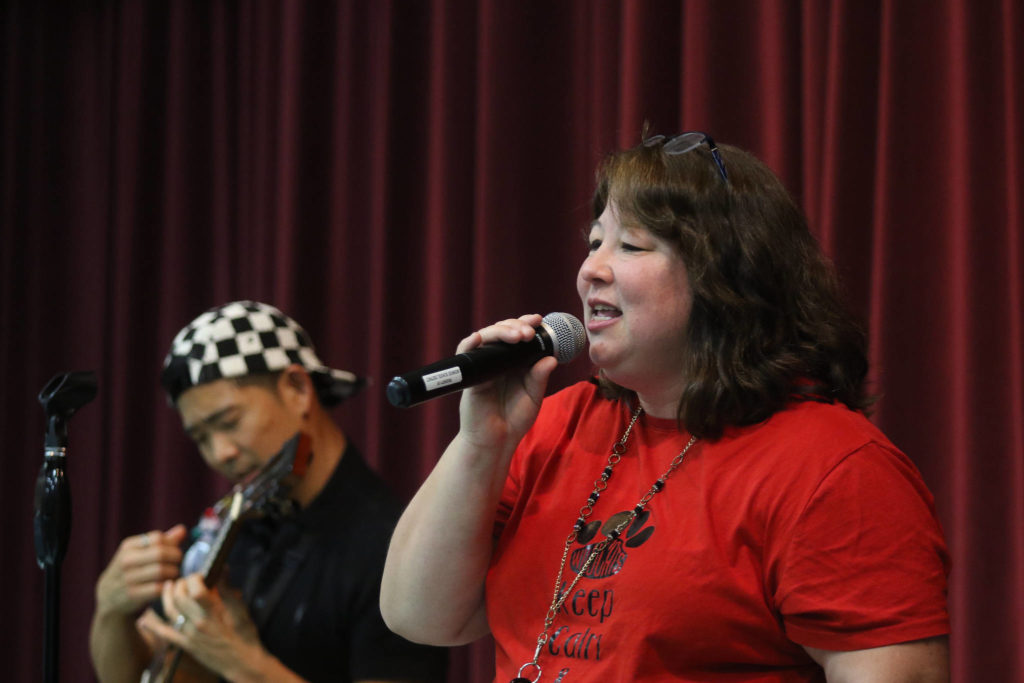 Music teacher Bobbie Ann George “Bohemian Rhapsody” with Jake Shimabukuro. (Andy Bronson / The Herald)
