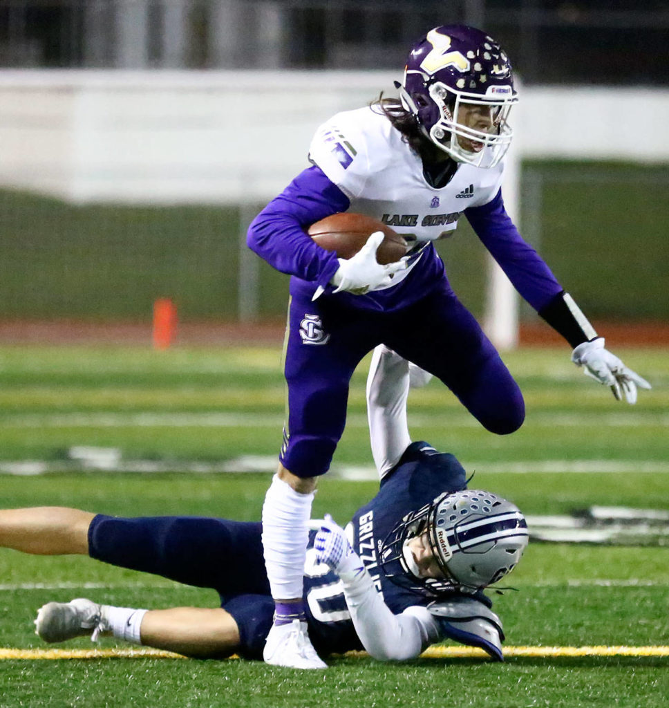 Lake Stevens’ Sergio Pelayo gathers after a reception over Glacier Peak’s Preston Weaver Friday night at Veterans Memorial Stadium in Snohomish on October 11, 2019. (Kevin Clark / The Herald)
