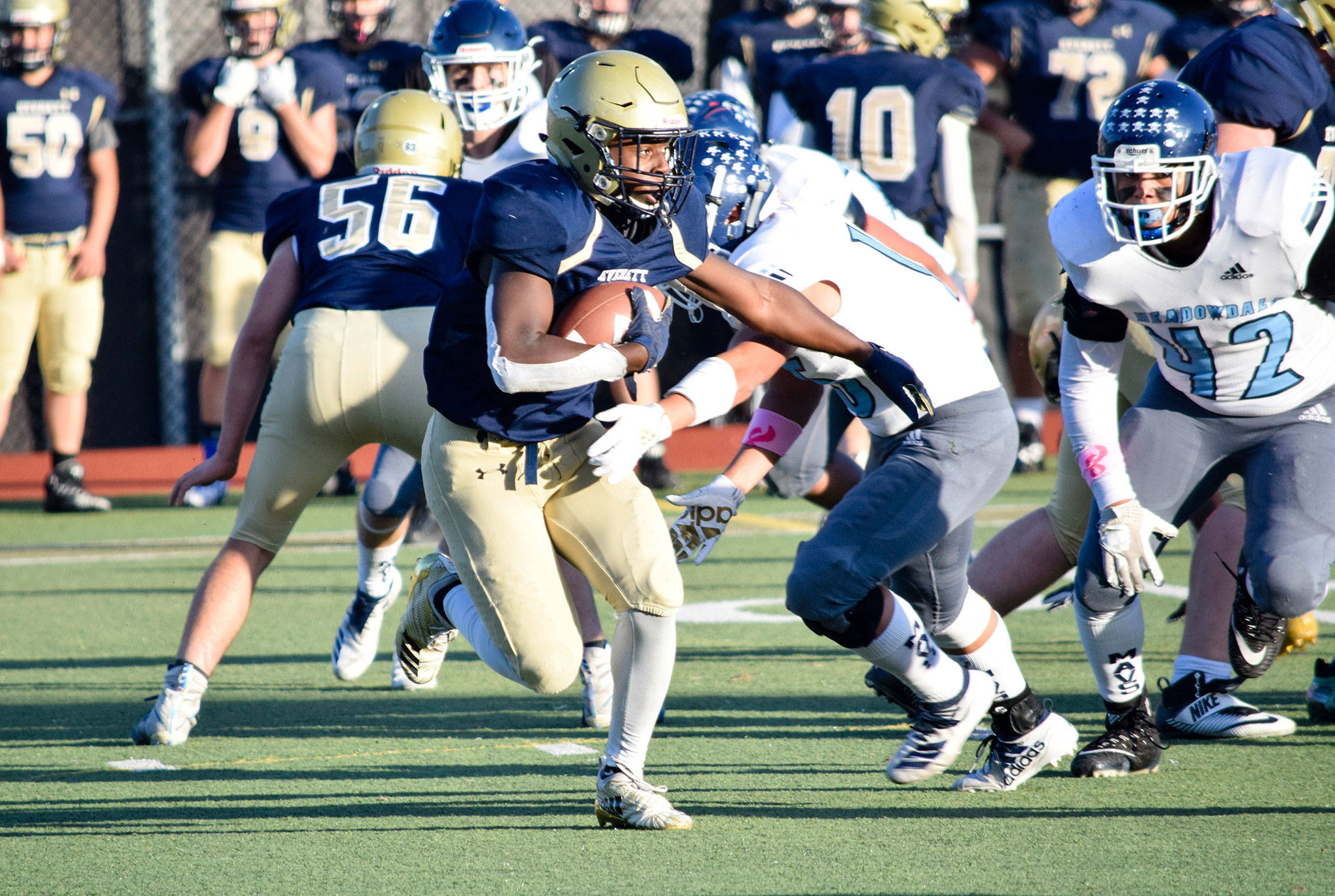 Junior running back Jeremy Reed runs past the Meadowdale defense on Friday, Oct. 11 at Everett Memorial Stadium. (Katie Webber / The Herald)