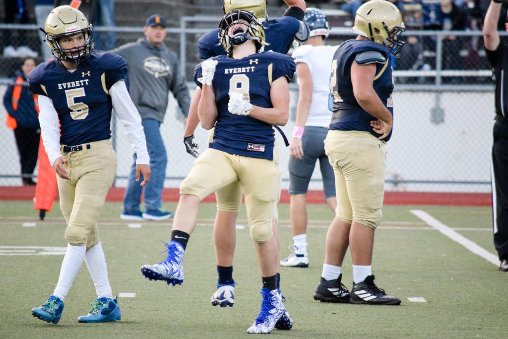 Sophomore Cavan Campbell celebrates after making a defensive stop against Meadowdale on Friday, Oct. 11 at Everett Memorial Stadium. (Katie Webber / The Herald)
