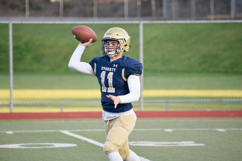 Sophomore quarter back Noah Schmid throws the ball to a receiver against Meadowdale on Friday, Oct. 11 at Everett Memorial Stadium. (Katie Webber / The Herald)
