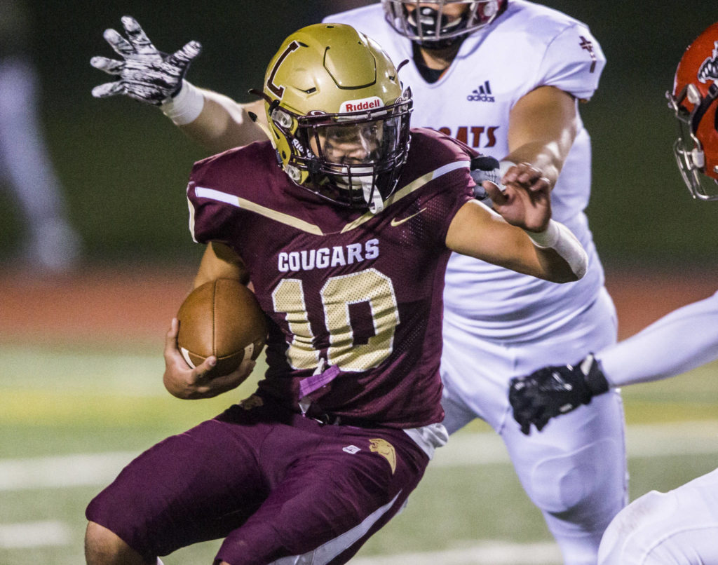 Lakewood’s Landen Pruitt runs the ball during the game on Friday, Oct. 11, 2019 in Arlington, Wash. (Olivia Vanni / The Herald)
