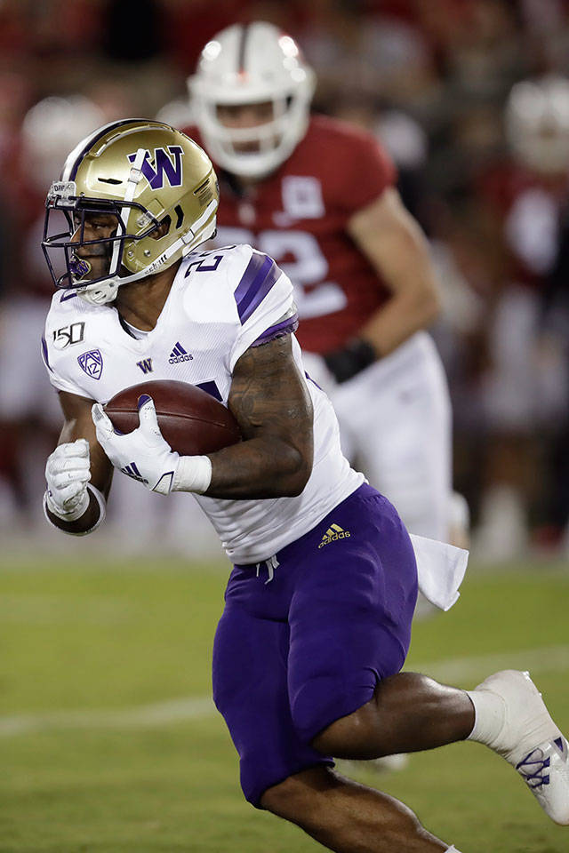 Washingtons Salvon Ahmed carries the ball during a game against Stanford Oct. 5, 2019, in Stanford, California. (AP Photo/Ben Margot)