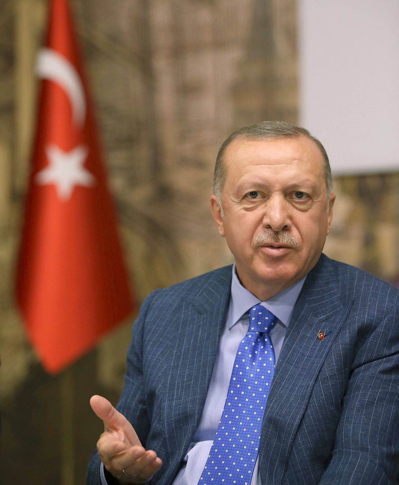 Turkey’s President Recep Tayyip Erdogan speaks to Turkish journalists Sunday in Istanbul. Erdogan has rejected offers for mediation with Syrian Kurdish fighters as the Turkish military continues its offensive against them in northern Syria. (Presidential Press Service via AP, Pool)