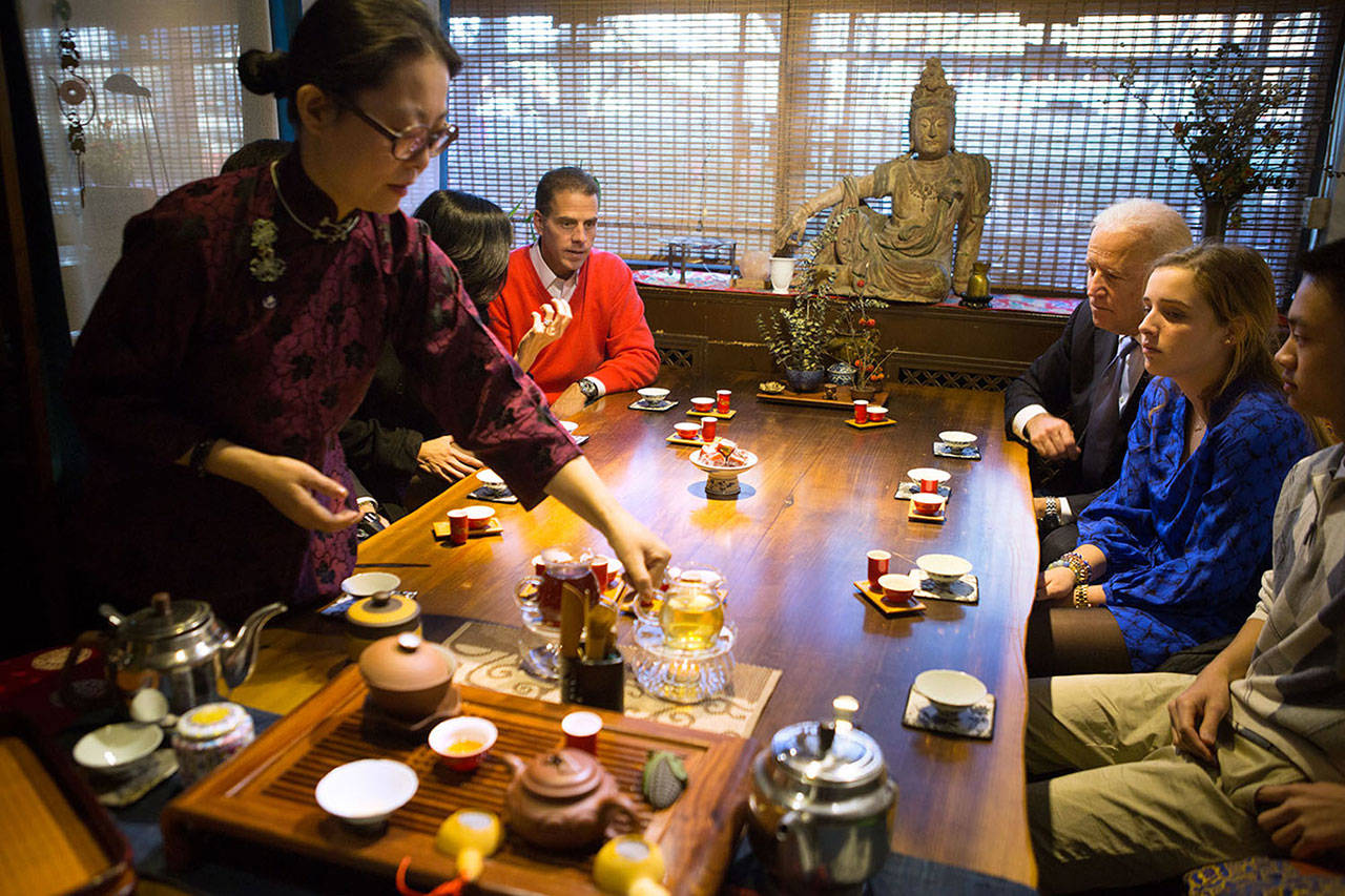 Vice President Joe Biden, son Hunter Biden and others experience a traditional tea tasting ceremony in Beijing in 2013. (David Lienemann/The White House)