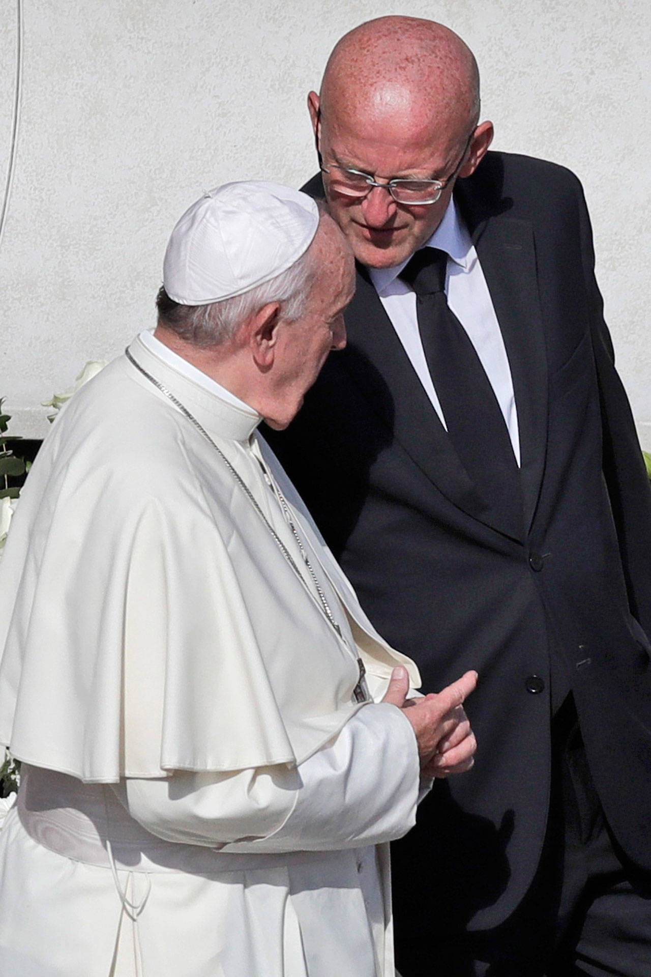 Vatican head of security Domenico Giani (right) shares a word with Pope Francis at the end of a canonization Mass in St. Peter’s Square at the Vatican on Sunday. The Vatican said Monday that Francis’ chief bodyguard Giani has resigned over the leak of a Vatican police flyer identifying five Holy See employees who were suspended as part of a financial investigation, adding that Giani bore no responsibility for the leak, but that he had resigned to ensure the serenity of the investigation and “out of love for the church and faithfulness” to the pope. (AP Photo/Alessandra Tarantino)