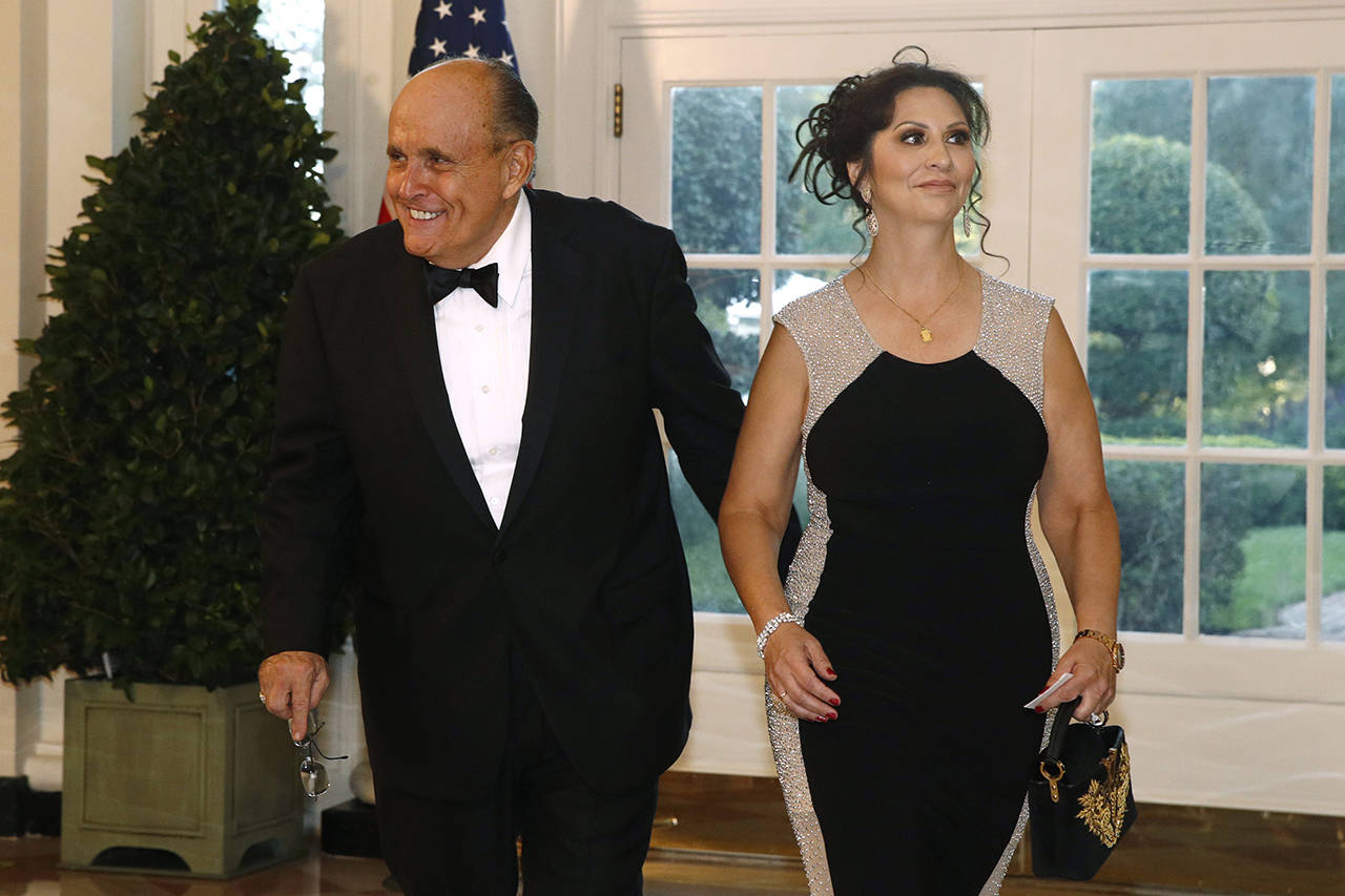 Rudy Giuliani and Maria Ryan arrive for a State Dinner with Australian Prime Minister Scott Morrison and President Donald Trump at the White House on Sept. 20. (AP Photo/Patrick Semansky, file)
