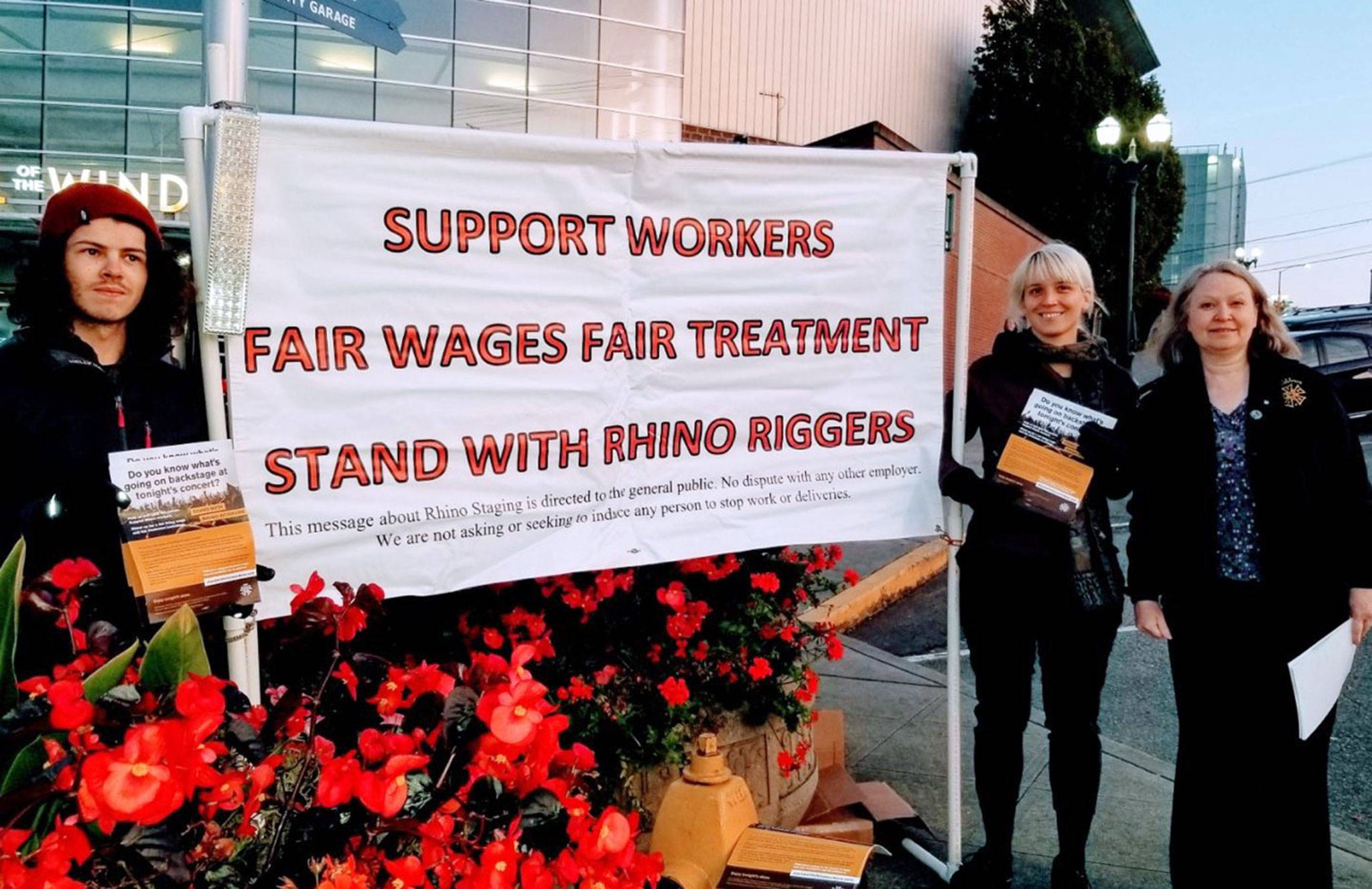 Members Julian Amrine (from left), Ellie Fog and Jennifer Bacon of the International Association of Theatrical and Stage Employees held pickets outside Angel of the Winds Arena in downtown Everett this fall. (International Association of Theatrical and Stage Employees)