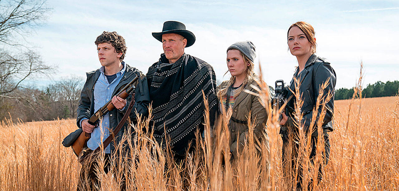 From left, Jesse Eisenberg, Woody Harrelson, Zoey Deutch and Emma Stone deploy snarky one-liners and shotguns to battle zombies in “Zombieland: Double Tap” (Columbia Pictures)