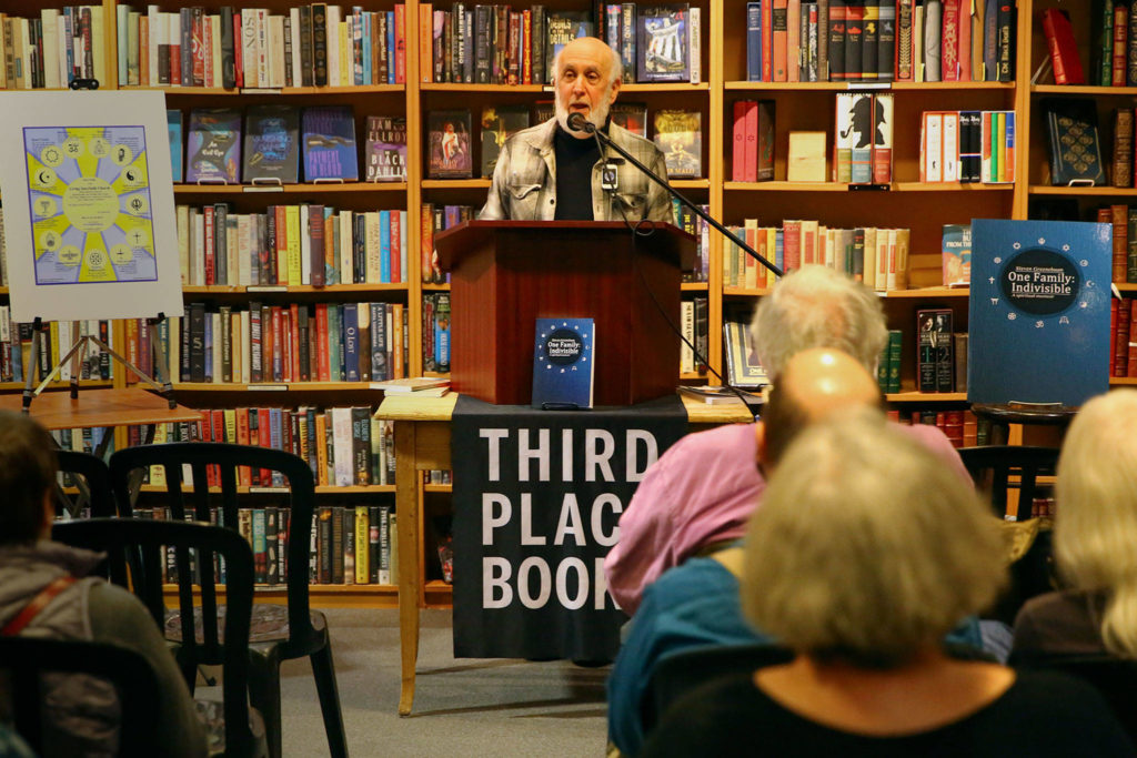 Steven Greenebaum talks about his new book, “One Family: Indivisible” at Third Eye Books in Lake Forest Park. (Kevin Clark / The Herald)
