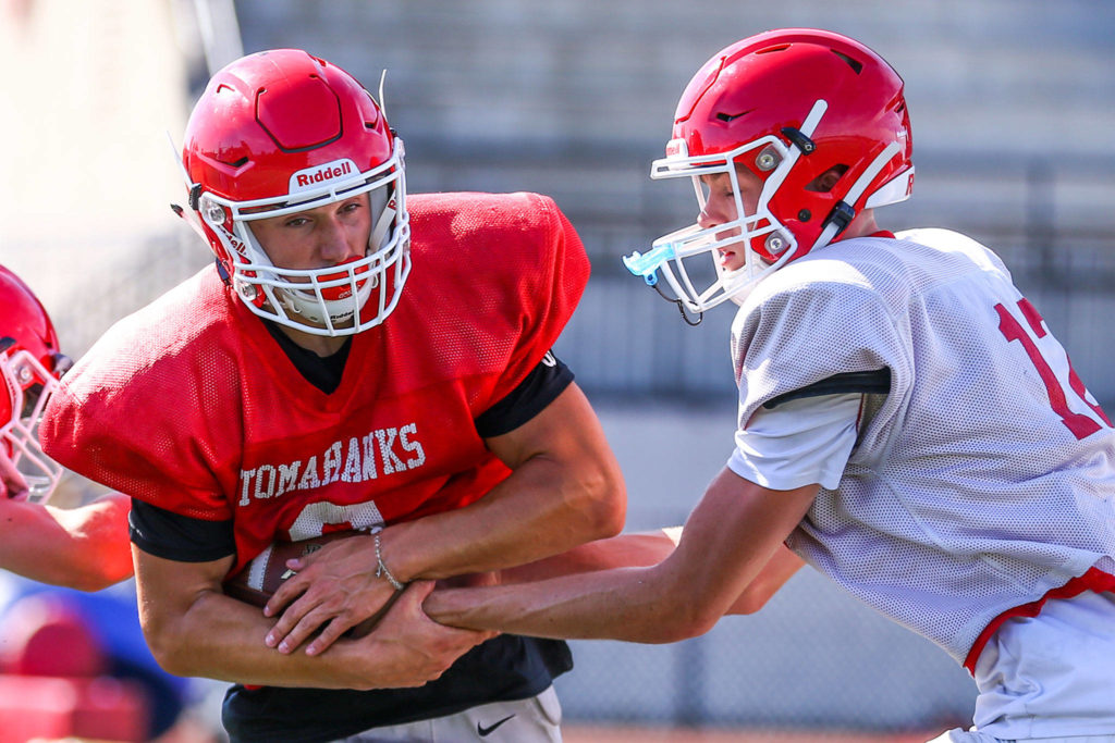 Jordan Justice (left), pictured during an August practice, has four touchdown runs of more than 55 yards. (Kevin Clark / The Herald)
