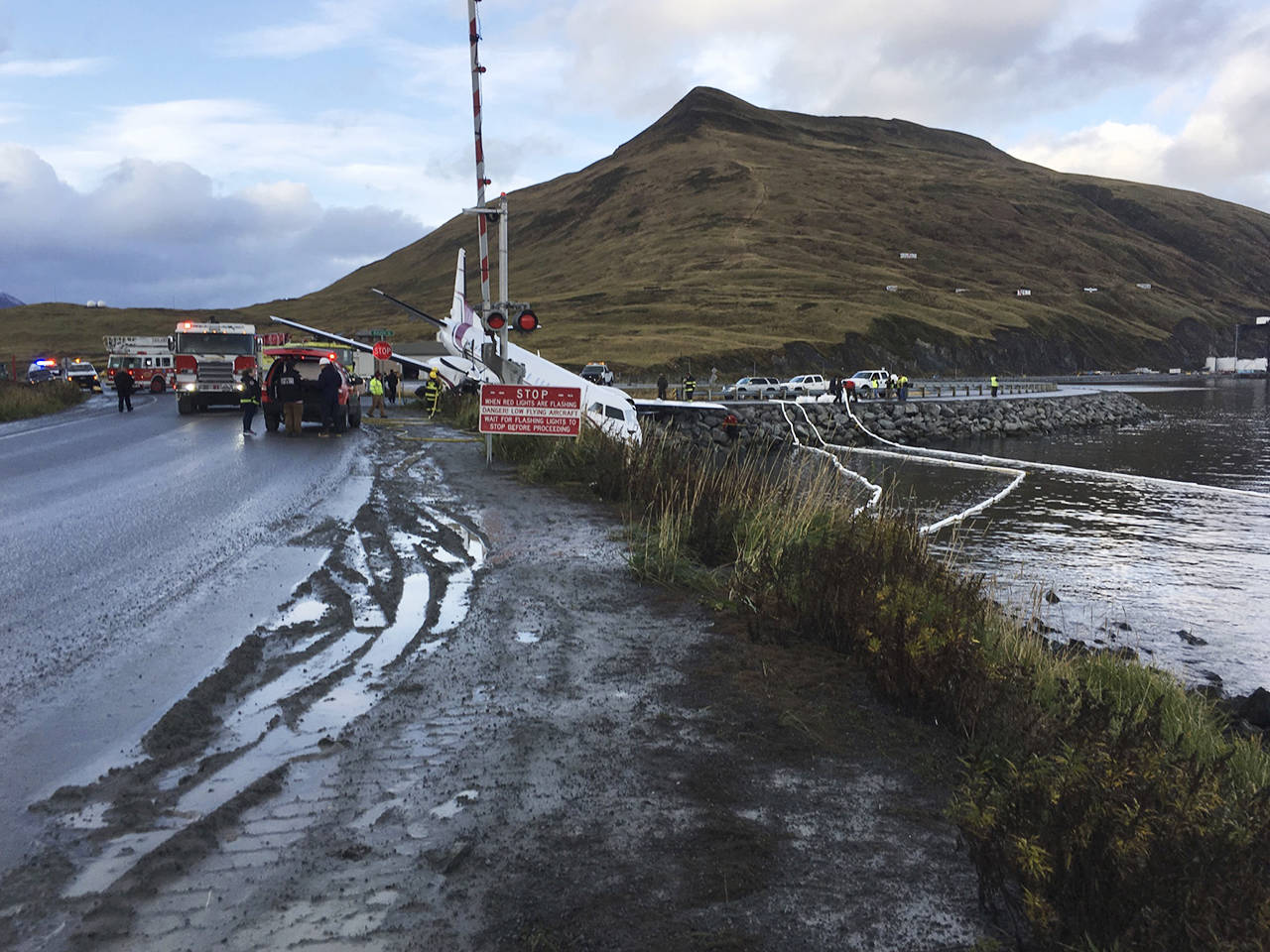 A commuter airplane crashed near the airport in a small Alaska community on the Bering Sea, on Thursday in Unalaska, Alaska. The Peninsula Airways flight from Anchorage to Dutch Harbor reportedly landed about 500 feet beyond the airport near the water. (Jim Paulin via AP)