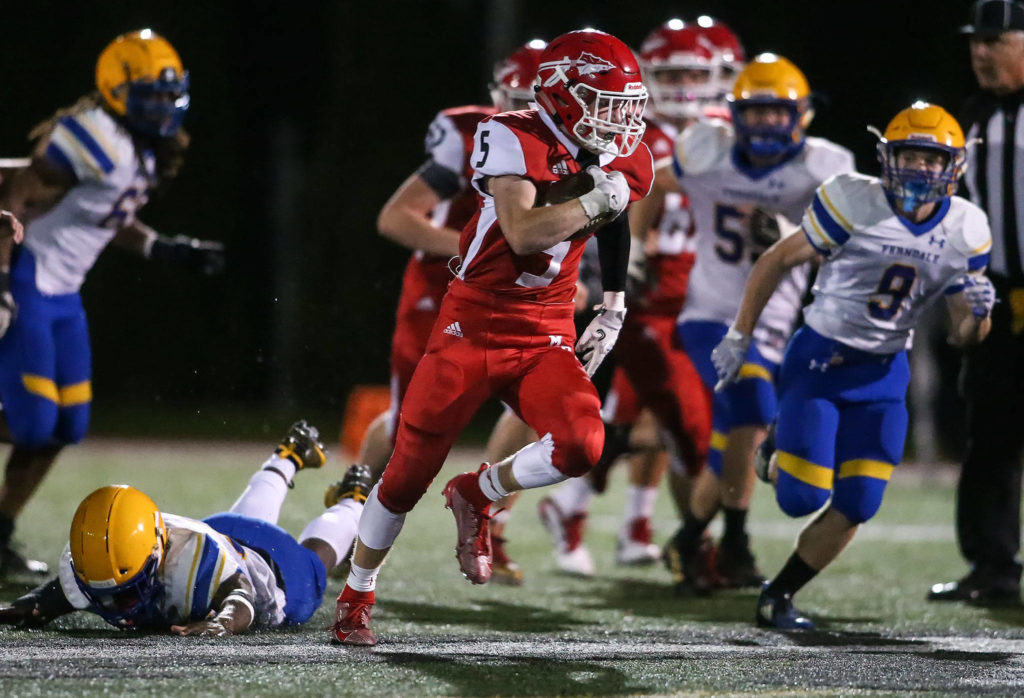 Dylan Carson ran for two long touchdowns early in the third quarter to help Marysville Pilchuck pull away from Ferndale. (Kevin Clark / The Herald)
