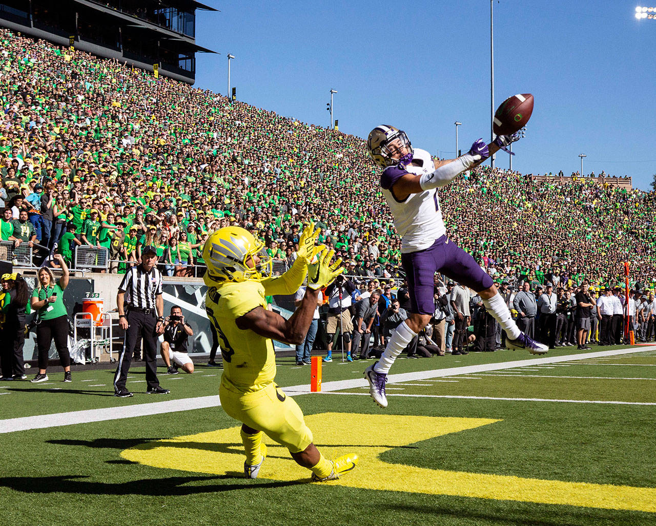 Washington defensive back Byron Murphy (1), breaks up a pass intended for Oregon wide receiver Dillon Mitchell (13) in the second quarter during a game in 2018 in Eugene, Ore. (AP Photo/Thomas Boyd)