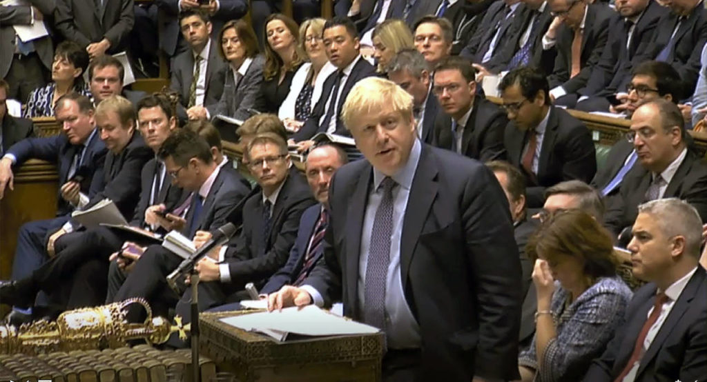 Britain’s Prime Minister Boris Johnson delivers a statement to lawmakers inside the House of Commons to update details of his new Brexit deal with EU, in London on Saturday. (House of Commons via AP)

