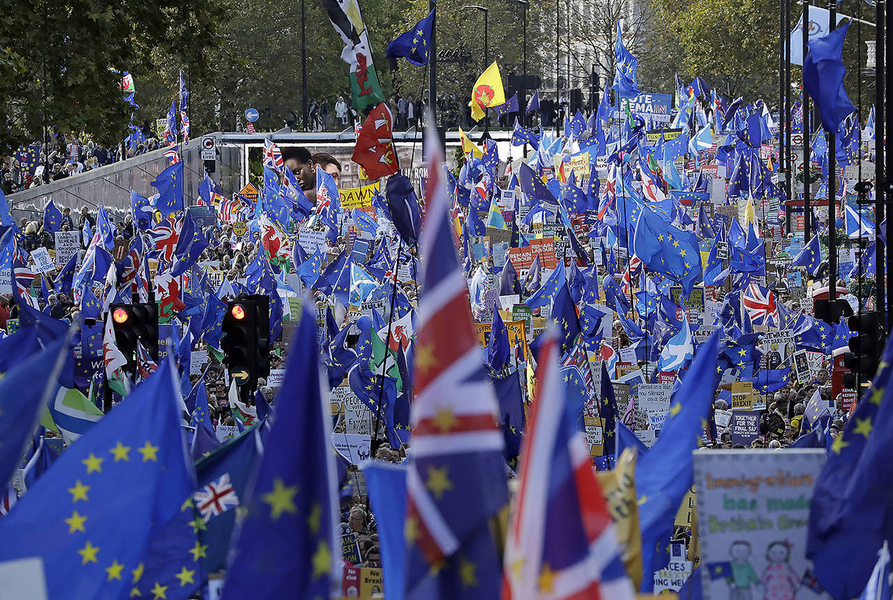 Anti-Brexit remain in the European Union supporters take part in a “People’s Vote” protest march calling for another referendum on Britain’s EU membership, in London on Saturday. (AP Photo/Matt Dunham)