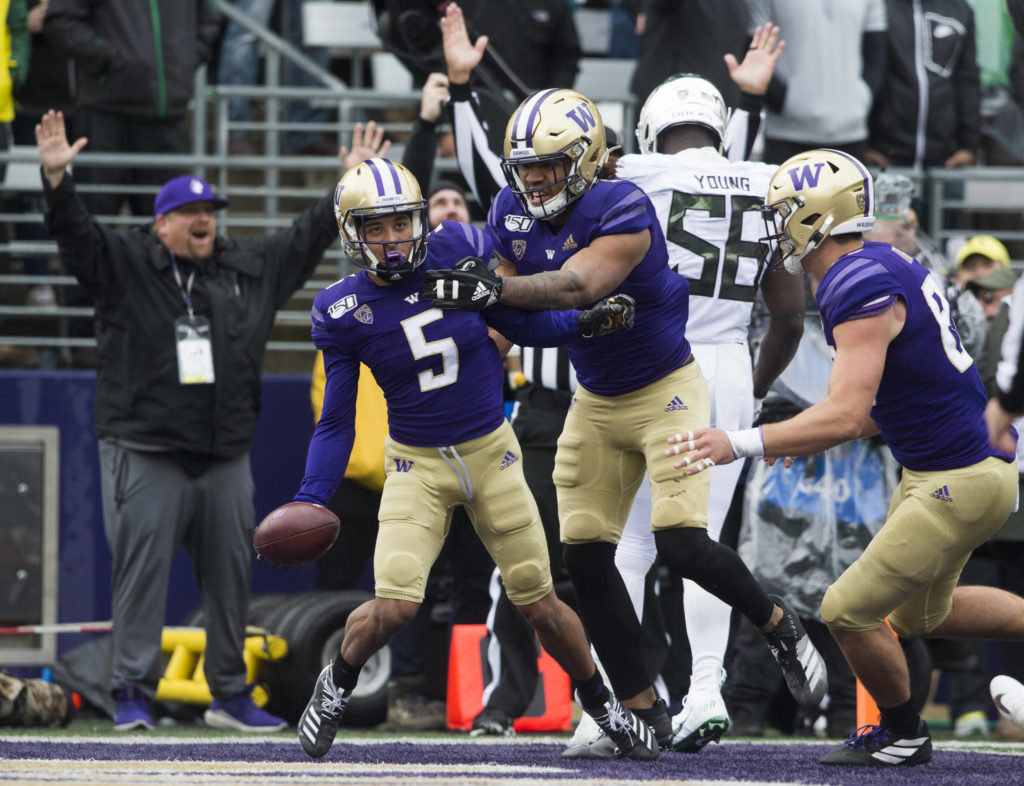 Washington Huskies’ Andre Baccellia celebrates after scoring a touchdown during the game against Oregon on Saturday, Oct. 19, 2019 in Seattle, Wash. (Olivia Vanni / The Herald)