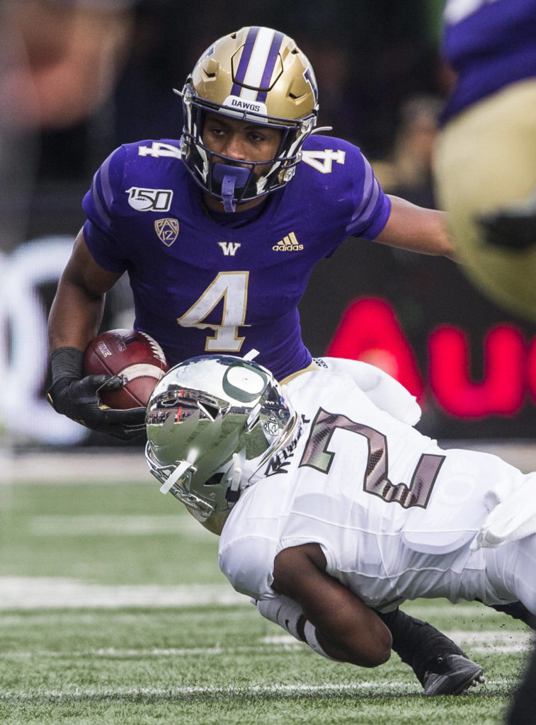 Washington Huskies’ Terrell Bynum is tackled by Oregon Ducks’ Mykael Wright during the game against Oregon on Saturday, Oct. 19, 2019 in Seattle, Wash. (Olivia Vanni / The Herald)