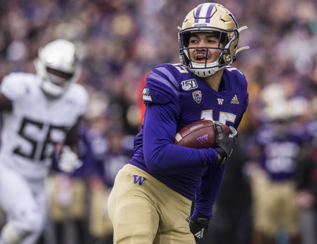 Washington’s Puka Nacua smiles as he runs the football in for a touchdown during the game against Oregon on Saturday, Oct. 19, 2019 in Seattle, Wash. (Olivia Vanni / The Herald)