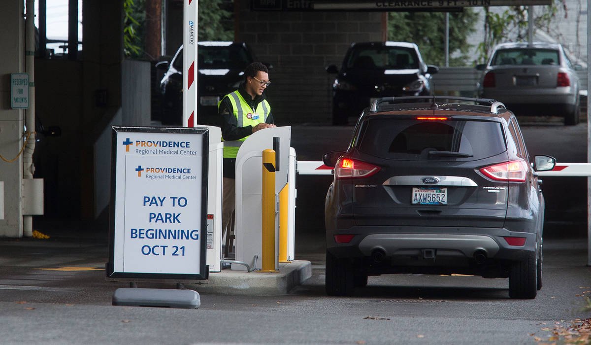Paid parking is set to start Monday at both of Providence Regional Medical Center Everett campuses for patients and visitors. Rates start at $1 for 90 minutes and rise to $4 for six or more hours. (Andy Bronson / The Herald)
