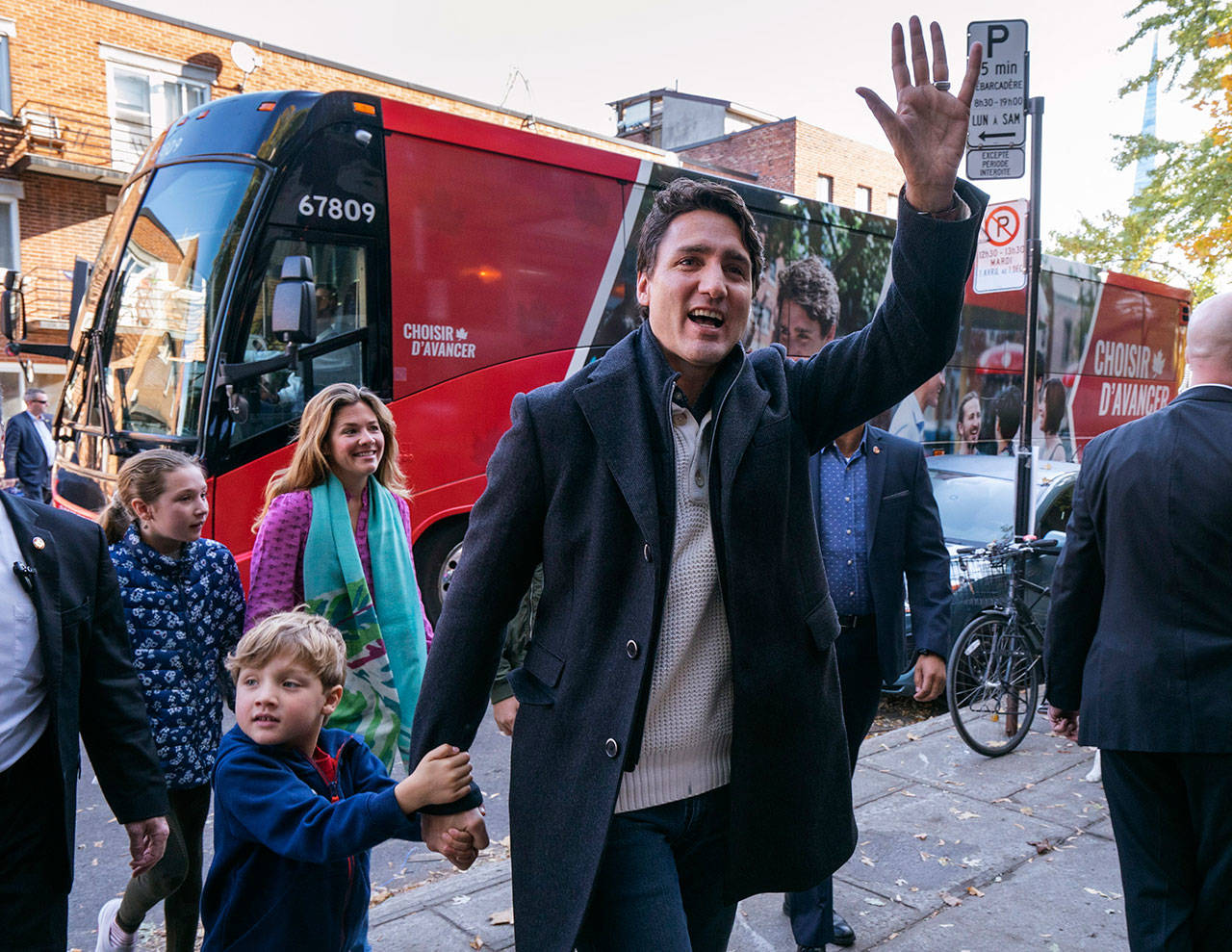 Canadian Prime Minister and Liberal leader Justin Trudeau arrives at the polling station Monday with his son, Hadrian, his wife, Sophie and daughter, Ella-Grace, in Montreal. (Paul Chiasson/The Canadian Press via AP)