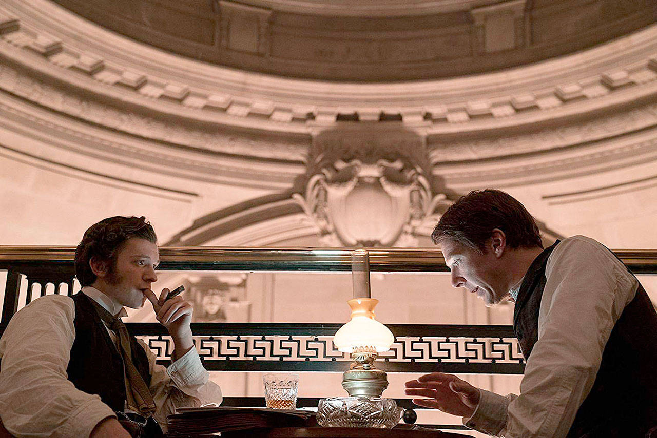 Benedict Cumberbatch (right) and Tom Holland map out the future of electricity in “The Current War.” (101 Studios)