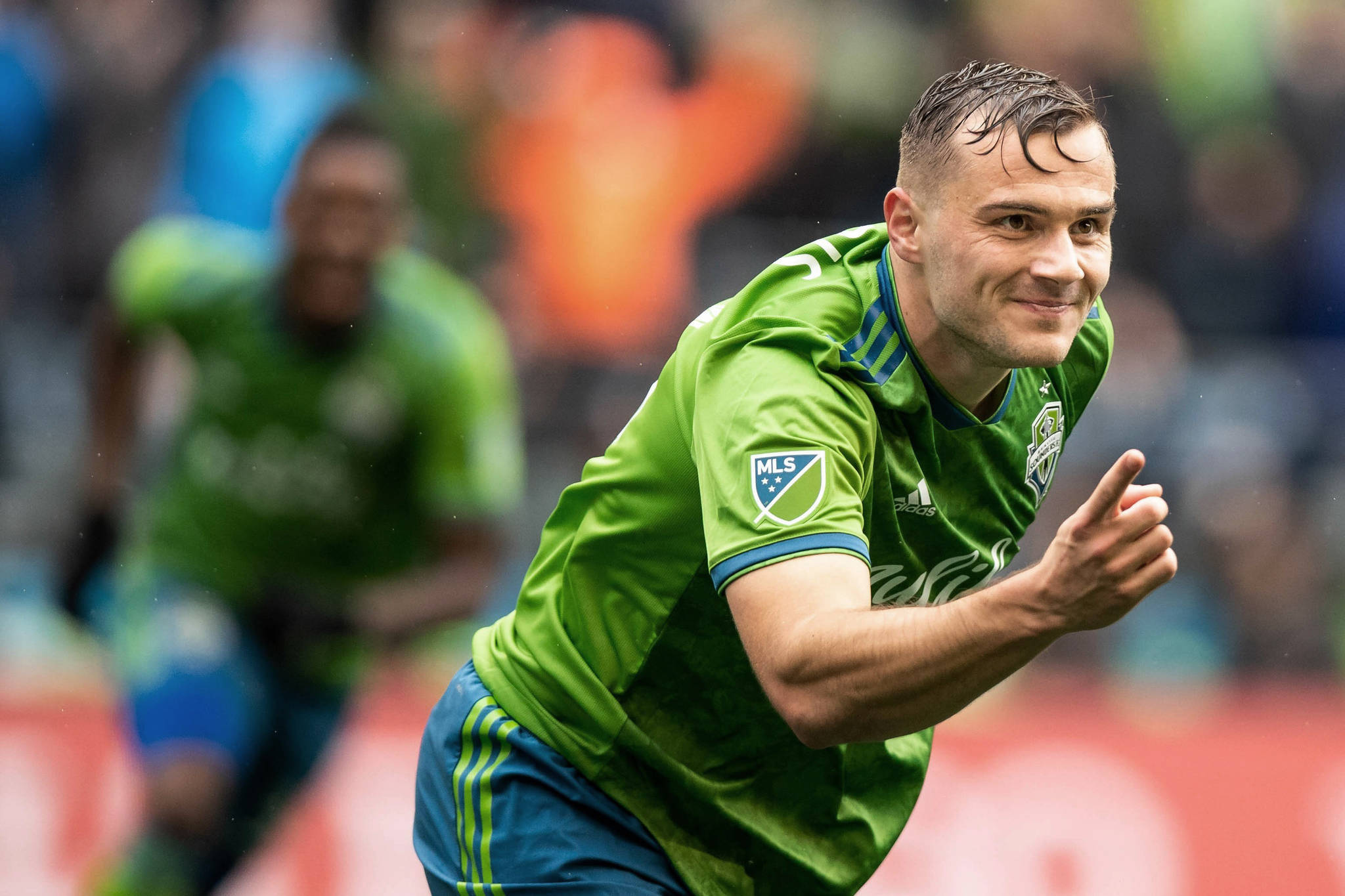 Seattle Sounders forward Jordan Morris celebrates the first of his three goals Saturday in the Sounders’ 4-3 playoff win over Dallas FC. (Andy Bao/The Seattle Times via AP)