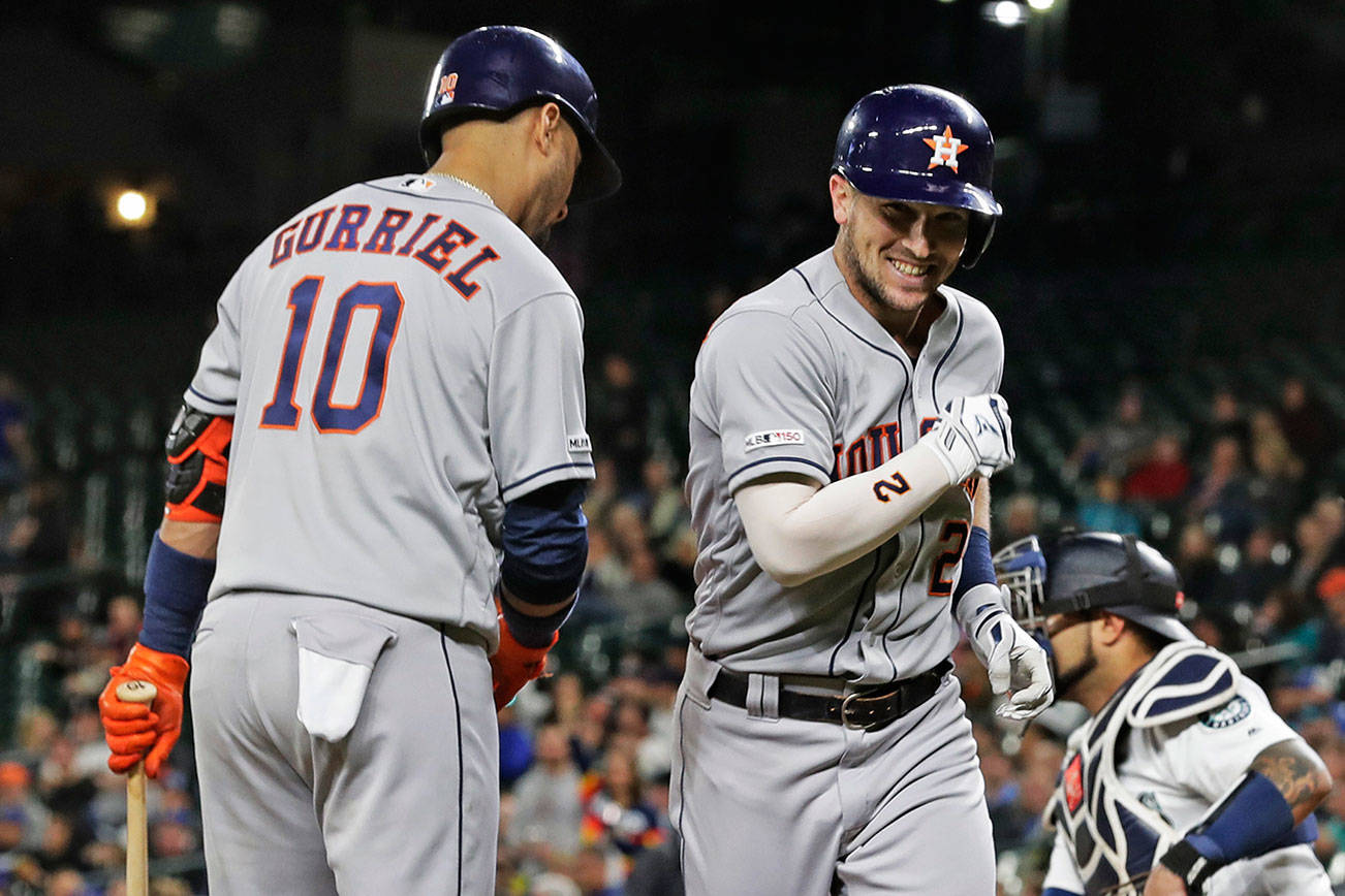 The voters favor Alex Bregman, Yuli Gurriel (10) and the Houston Astros over the Washington Nationals in the World Series. (AP Photo/Ted S. Warren)