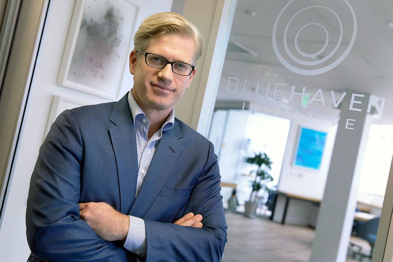 Ian Simmons, co-founder and principal of Blue Haven Initiative, poses Friday at his office in Cambridge, Massachusetts. A handful of billionaires and multimillionaires are making a renewed push for the government to raise their taxes and siphon away some of their holdings. (AP Photo/Michael Dwyer)