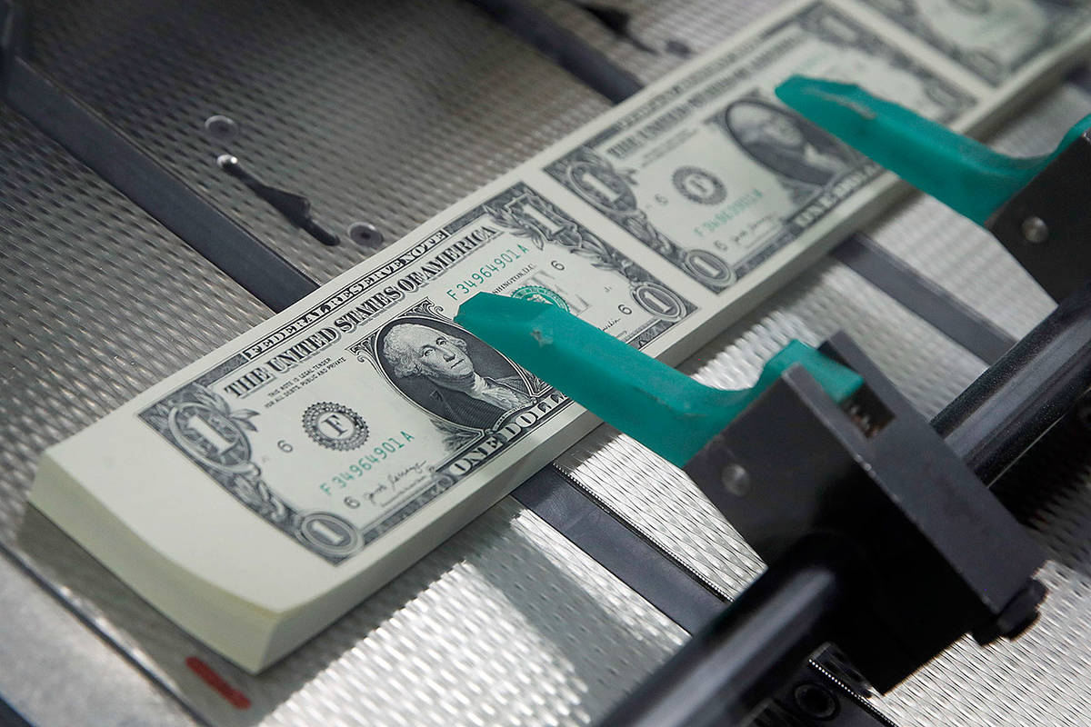 Among the responsibilities of the Snohomish County Treasurer are collecting tax payments, disbursing those funds to county departments and taxing districts and investing funds for the county and districts. (Jacquelyn Martin / Associated Press file photo)