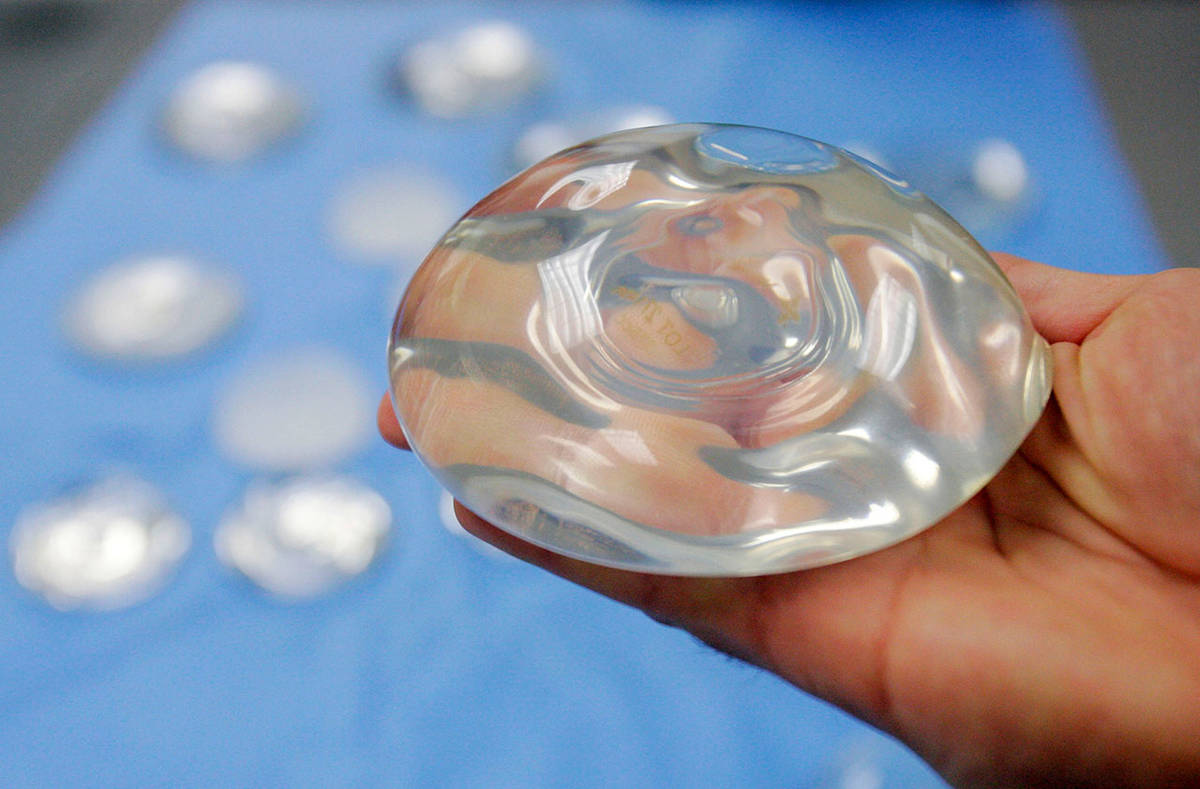 This Dec. 11, 2006 file photo shows a silicone gel breast implant in Irving, Texas. On Wednesday, the U.S. Food and Drug Administration said that breast implant manufacturers should add a boxed warning — the most serious type — to information used to market and prepare patients for implants. (AP Photo/Donna McWilliam, File)