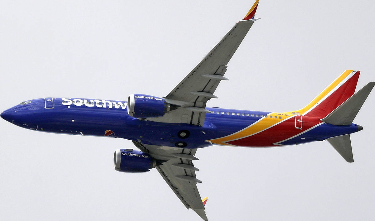 In this March 13 photo, a Southwest Airlines Boeing 737 Max 8 jet flies over Mesa, Arizona, en route to Phoenix’s Sky Harbor International Airport. (AP Photo/Elaine Thompson, File)