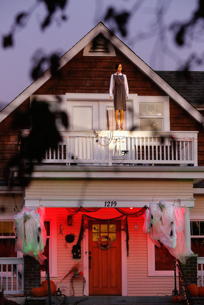 In a terrifying scene borrowed from the horror film “The Omen,” a mannequin stands on the second-floor balcony rail of a house on Everett’s Hoyt Avenue. (Dan Bates / The Herald)
