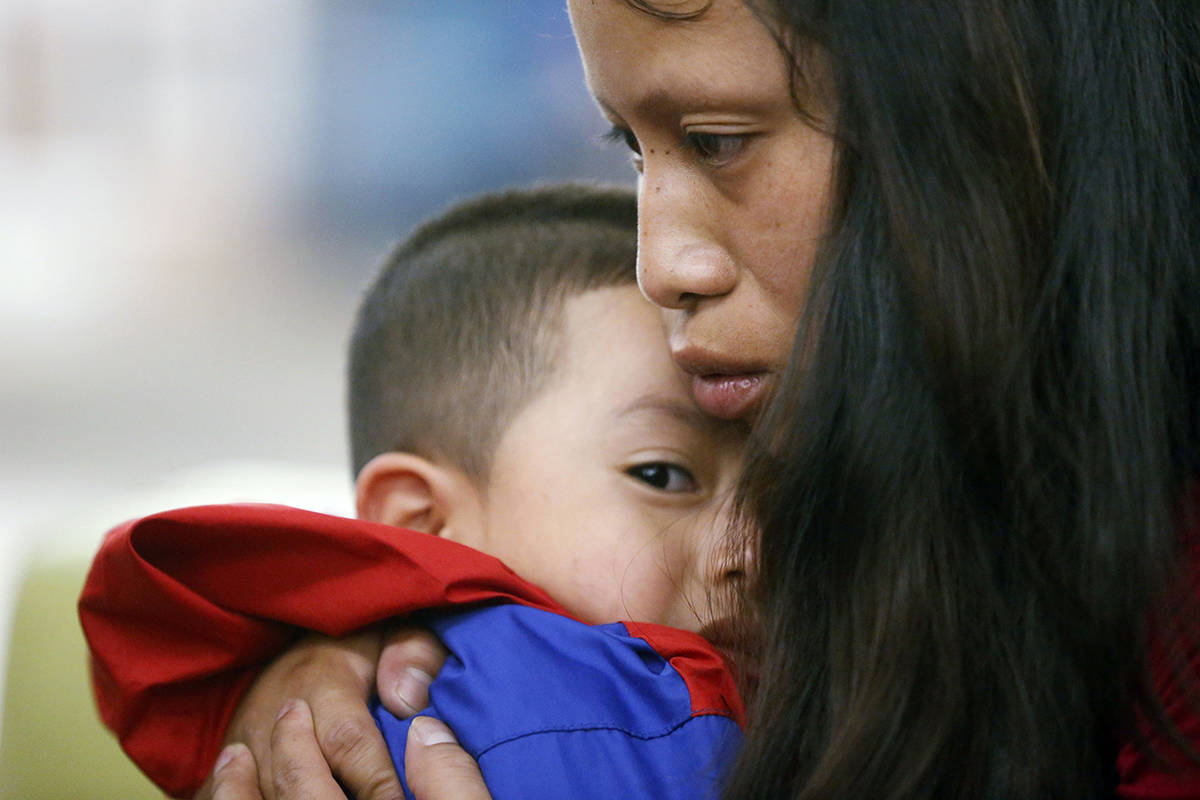 In this July 2018 photo, Maria holds her 4-year-old son Franco after he arrived at the El Paso International Airport in El Paso, Texas. The two had been separated for over six weeks after entering the country. (Ruben R. Ramirez/The El Paso Times via AP, File)