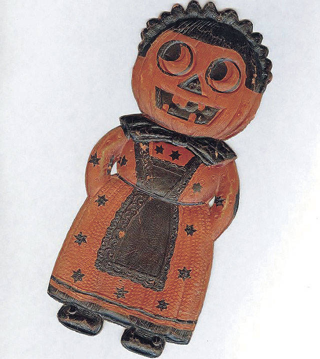 Save your Halloween decorations. Pressed cardboard is still used to make decorations like this 8-inch-tall paper jack-o’-lantern dressed like a maid with a black apron and curly hair. The 1930s decoration was in great condition and sold for $90. (Cowles Syndicate Inc.)