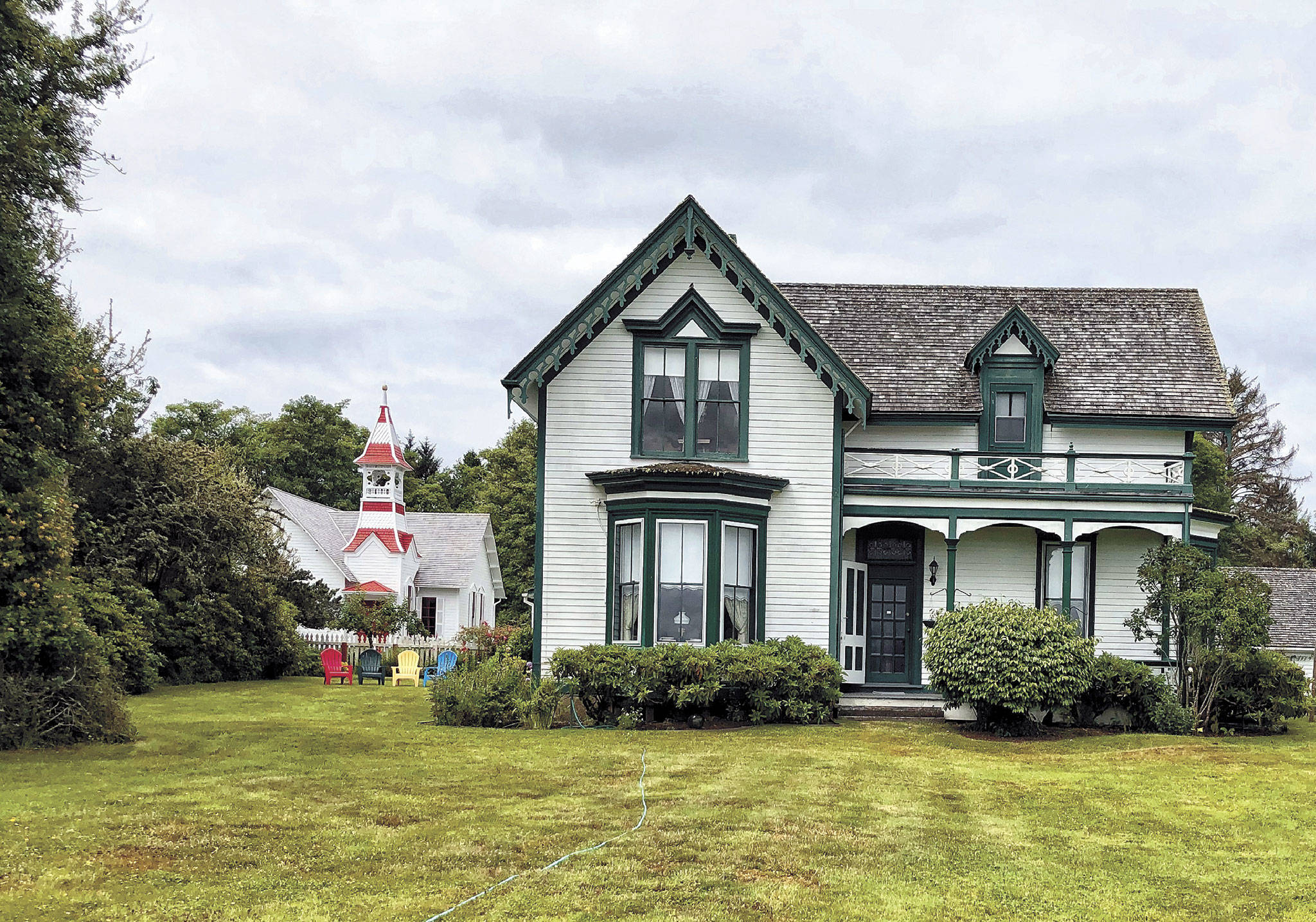 One of Oysterville’s oldest homes was built in 1869. The federal land grant deed, signed by President Abraham Lincoln, still hangs on a wall inside. The house is now owned by Sydney Stevens, a descendant of Oysterville co-founder R.H. Espy. In the background is the Oysterville Church, built in 1892 and usually open for tours. (Photo by Patricia Jollimore)
