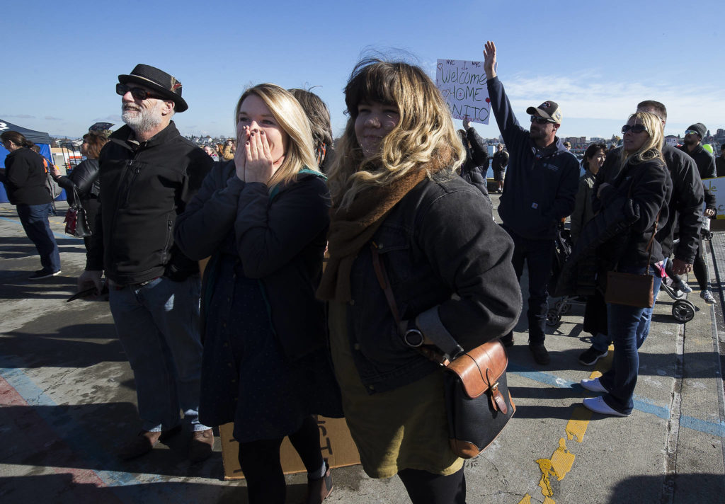 With her boyfriend coming into view, Sydney O’Neil reacts as the USS Momsen (DDG-92) nears the pier on its return to Naval Station Everett after a deployment to the Pacific on Monday in Everett. (Andy Bronson / The Herald)
