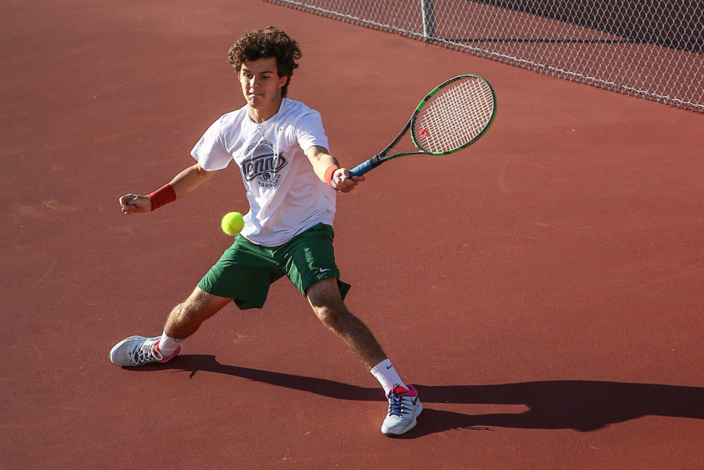 Edmonds-Woodway’s Sebastian Fernandez, a foreign exchange student from Mexico, won a pair of matches Tuesday to punch his ticket to state and advance to the district final. (Kevin Clark / The Herald)
